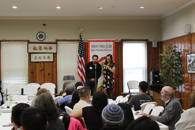 Man and woman speak at Pacific Atrocities Education Summer Showcase and Fundraiser event