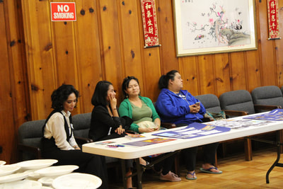 Individuals sitting at Pacific Atrocities Education Summer Showcase and Fundraiser event
