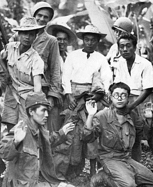 resistance fighters guarding Japanese prisoners
