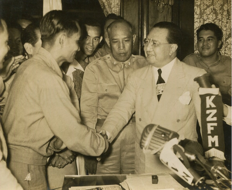 Luis Taruc (Left) shaking hands with President Quirino (Right). 21 June 1948.